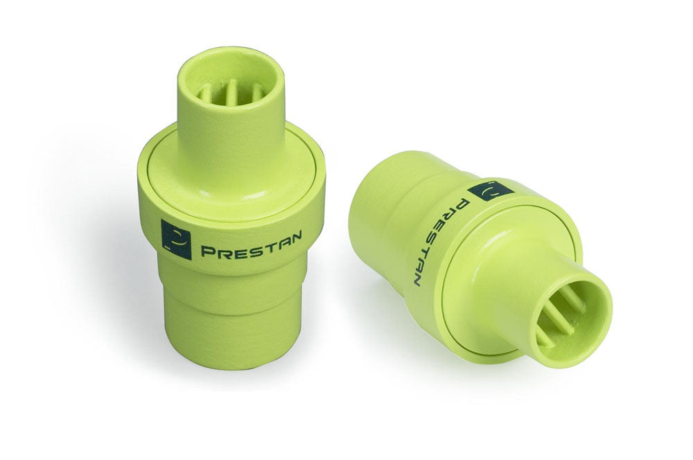 Two green, disposable Prestan Training Mask Adaptors with ribbed interiors, ideal for CPR training, placed on a white background.