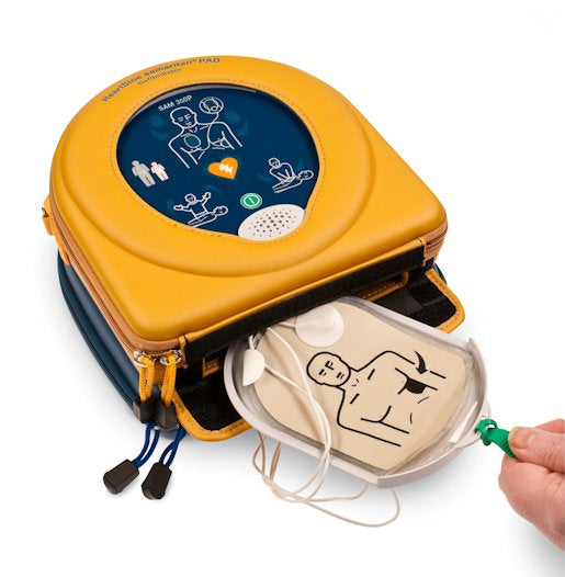 The HeartSine Samaritan 350P defibrillator, encased in yellow, comes with electrode pads and diagrams to guide correct placement on a patient. This device by HeartSine features portable defibrillation technology and includes a handy Pad-Pak cartridge for effortless use.