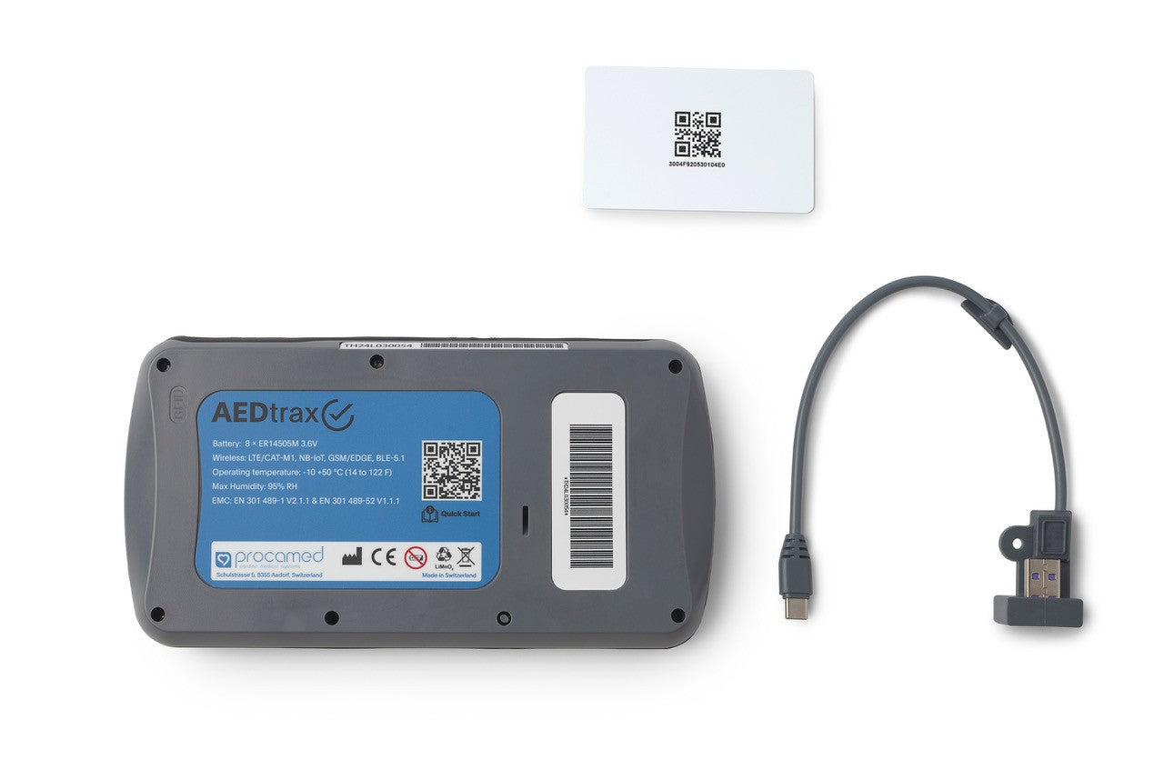 AEDTrax device with USB cable on a white background