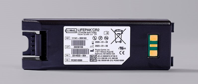 A Physio-Control/STRYKER Lifepak CR2 Replacement Battery, labeled with specifications and certification marks, boasts a 4-year operational lifespan. It is displayed on a gray background.