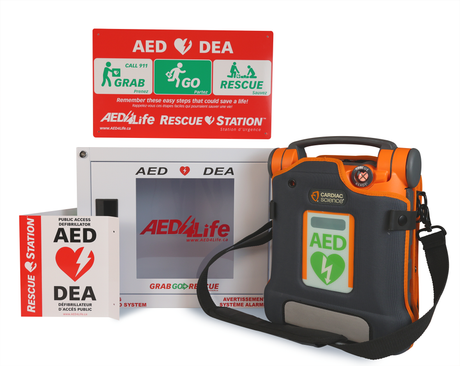 The Cardiac Science G5 BILINGUAL AED - Complete Package by Cardiac Science is a wall-mounted rescue station that includes a bilingual defibrillator, clear emergency instructions, and real-time CPR coaching to guide users through the defibrillation process.