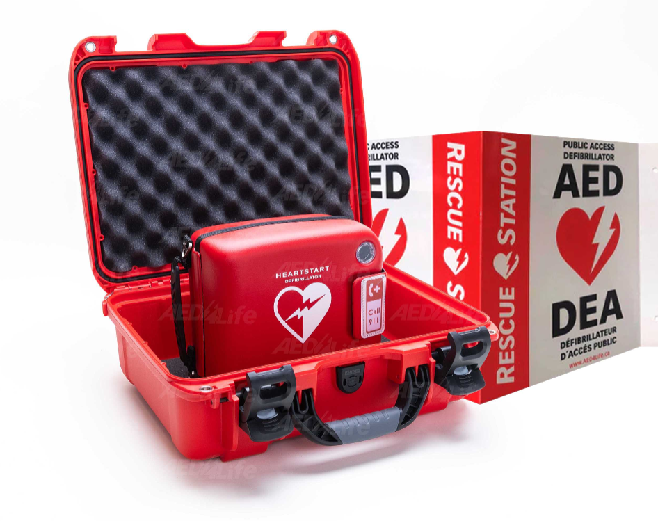 Red Defibrillator in an open case with a box labeled 'Rescue Station AED' in the background.