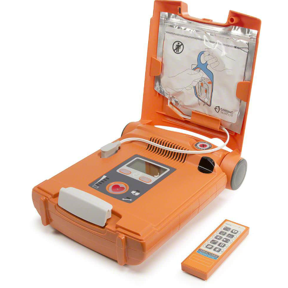 Orange defibrillator with accessories on a white background