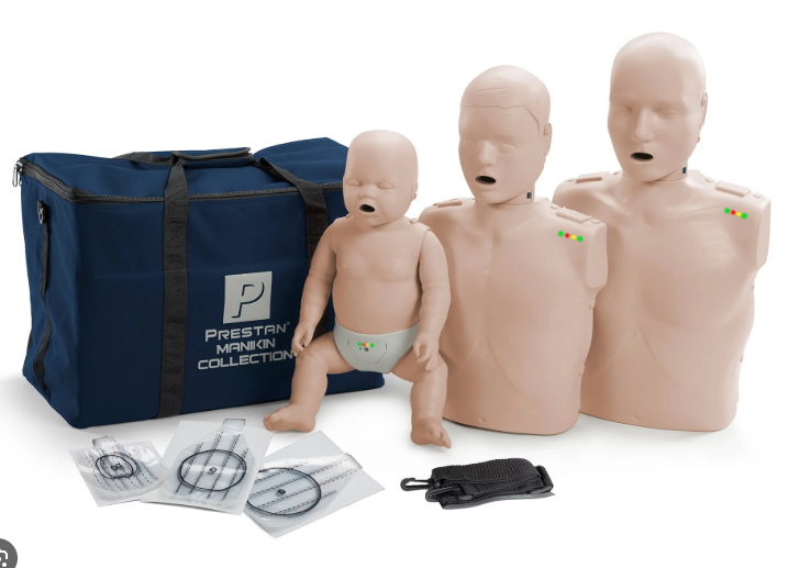 Prestan mannequins and training equipment including a navy bag with 'Prestan' branding.