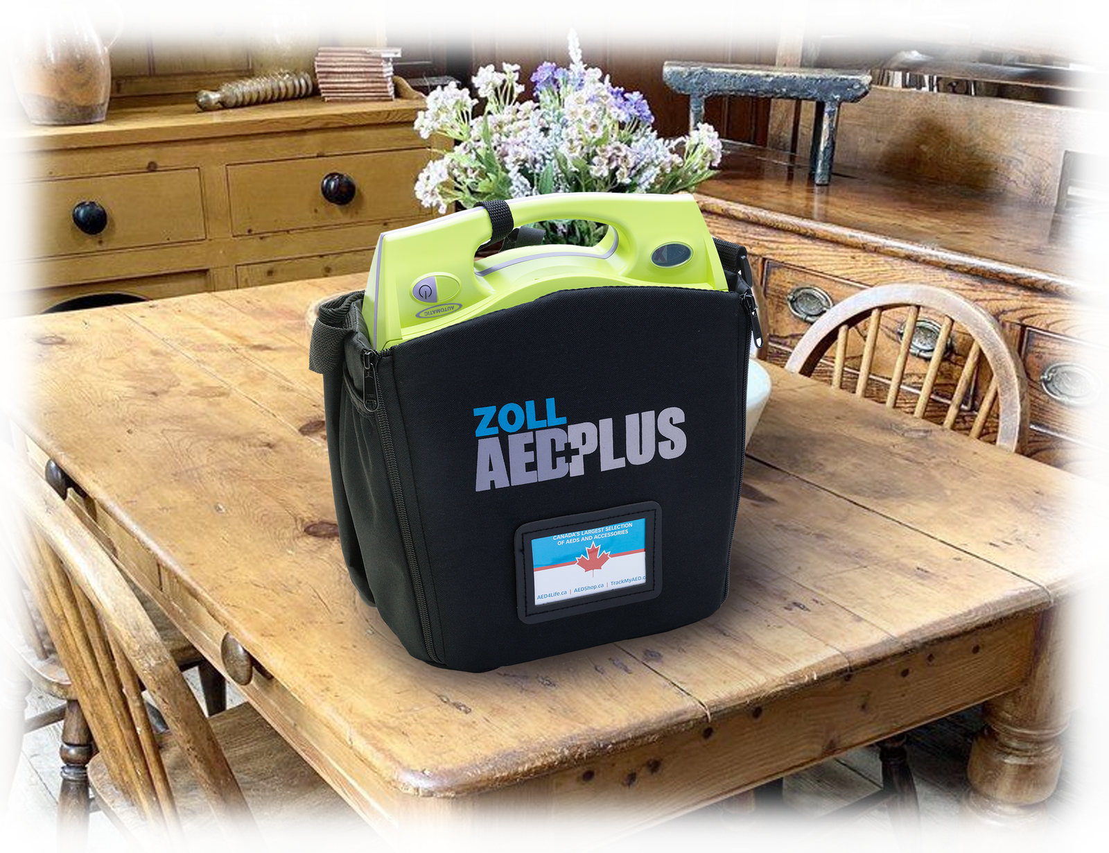An AED4Life AED Summer Cottage Rental defibrillator in a black case is on a wooden dining table in a rustic kitchen, ideal for seasonal rental at your cottage.