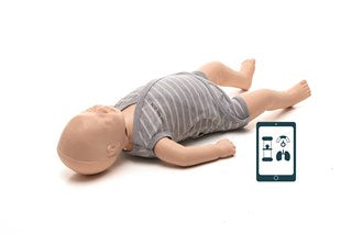 Infant CPR manikin in a white and grey striped onesie laying down on the ground looking upwards.