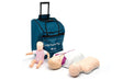 Two adult CPR manikins laying on the ground besides an infant CPR manikin leaning against a cyan bag with black handles.