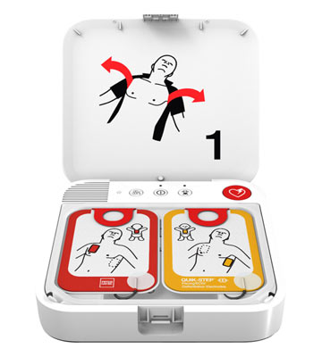 An open Physio-Control LIFEPAK CR2 with WiFi - Bilingual AED by Physio-Control/STRYKER, displaying two electrode pads and instructions on placing them on a person's chest.