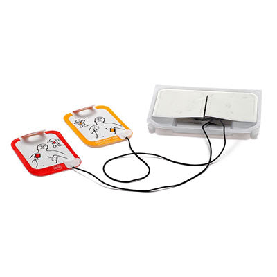 AED pads with illustrated diagrams showing proper placement on a person are connected by wires to the Physio-Control LIFEPAK CR2 with WiFi- Bilingual defibrillator unit from Physio-Control/STRYKER, integrating advanced CPR technology.