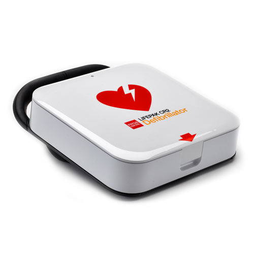 White defibrillator with black handle and a logo of a red heart and a lightning bolt.