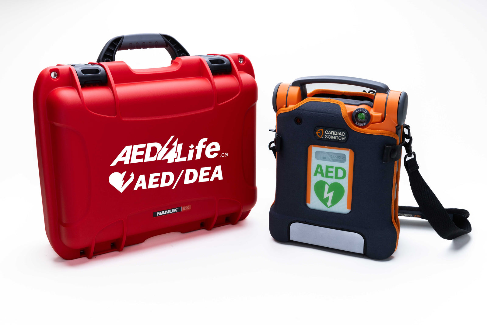 A Cardiac Science G5 BILINGUAL AED Construction and Workplace Safety Bundle by Cardiac Science sits next to a red AED carrying case with a green AED label and black shoulder strap, vital for rapid response in cardiac emergencies.