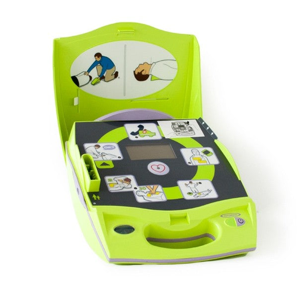 A ZOLL AED Plus from ZOLL, featuring a partially open lid, reveals instructional illustrations and Real CPR Help for effective use.